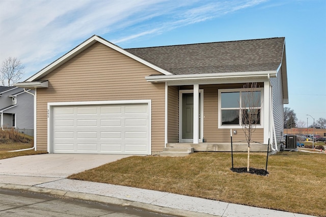 single story home with central AC unit, a front yard, and a garage