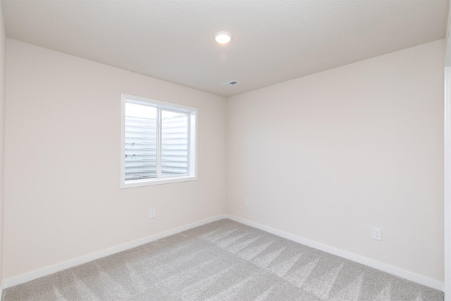 unfurnished room featuring carpet floors