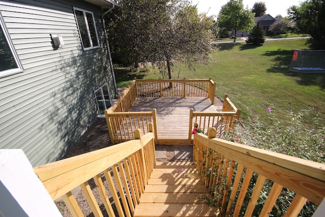 wooden deck with a yard