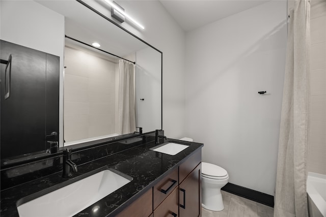 full bathroom featuring shower / bathtub combination with curtain, vanity, and toilet