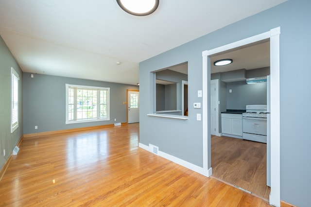 unfurnished room featuring light hardwood / wood-style floors