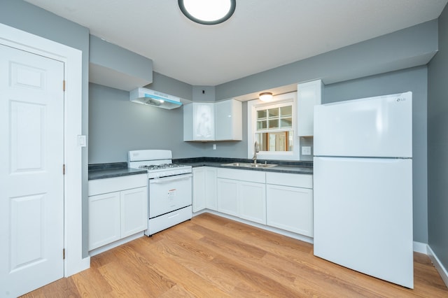 kitchen with light wood-type flooring, sink, white appliances, and white cabinetry