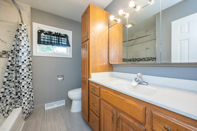 full bathroom featuring shower / bath combo, vanity, and toilet