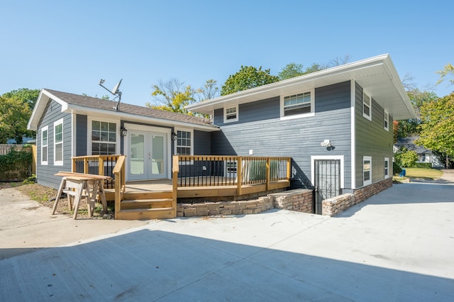 back of house featuring a deck, french doors, and a patio area