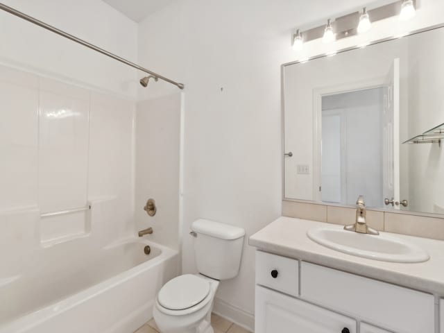 full bathroom featuring toilet, tile patterned flooring, vanity, and shower / bathtub combination