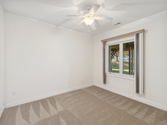 unfurnished room featuring carpet floors and ceiling fan