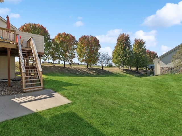 view of yard featuring a wooden deck