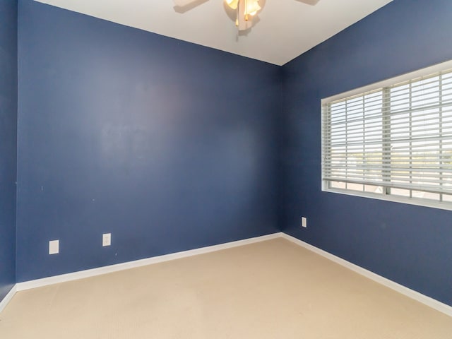 carpeted empty room with ceiling fan