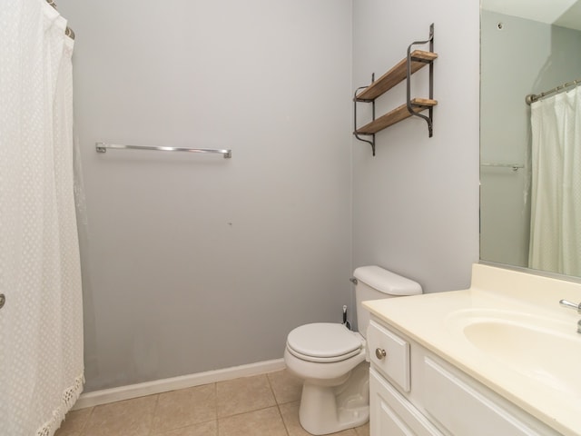 bathroom with tile patterned floors, toilet, vanity, and a shower with curtain