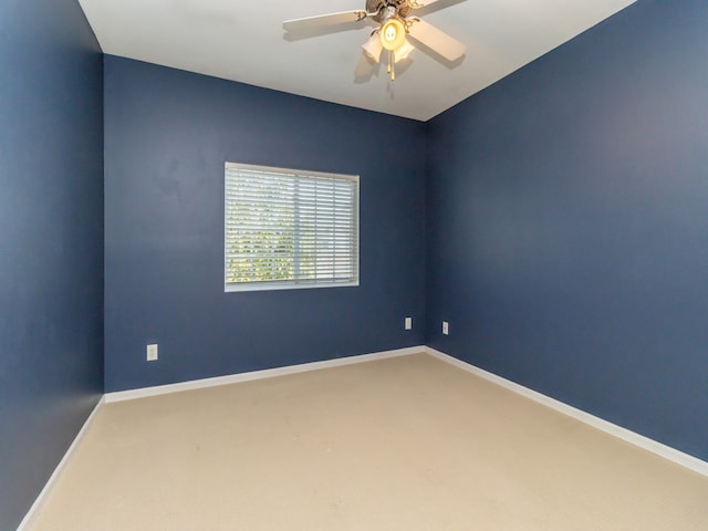 unfurnished room featuring ceiling fan and carpet floors