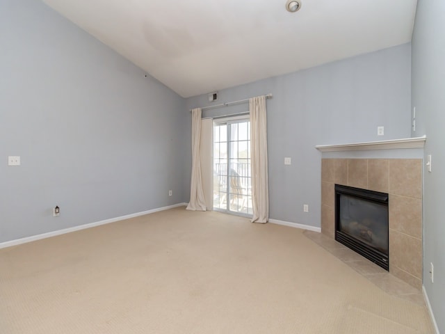 unfurnished living room with light carpet and a fireplace