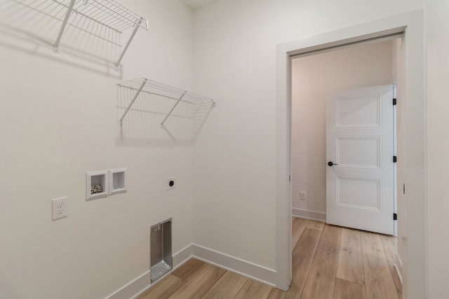 laundry room featuring light hardwood / wood-style flooring, washer hookup, and hookup for an electric dryer