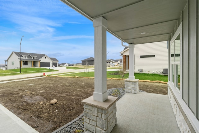 view of patio featuring a porch and central air condition unit