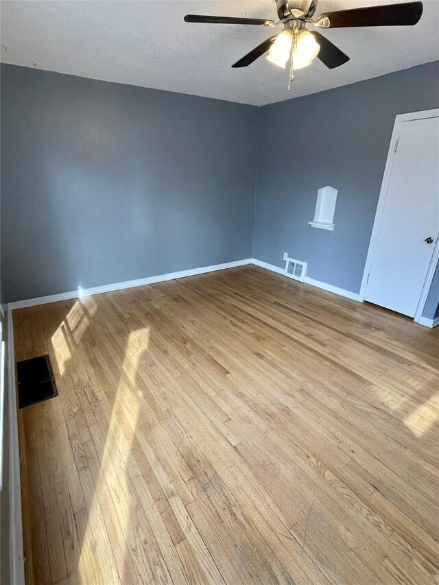 5711 Franklin Ave, Des Moines, IA 50310 - spare room featuring hardwood / wood-style flooring, a ceiling fan, and baseboards