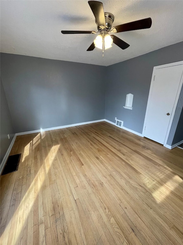 5711 Franklin Ave, Des Moines, IA 50310 - empty room featuring wood-type flooring, ceiling fan, and baseboards