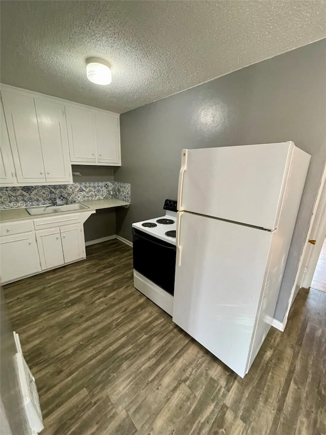 5711 Franklin Ave, Des Moines, IA 50310 - kitchen with white appliances, a sink, a textured ceiling, white cabinets, and dark wood finished floors