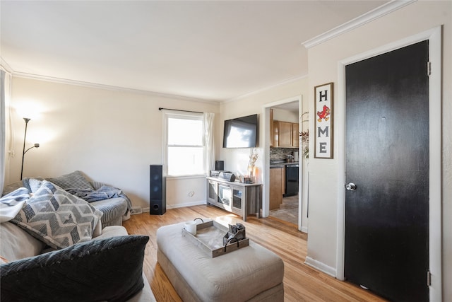 living room featuring ornamental molding and light hardwood / wood-style floors