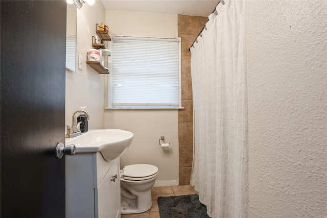 bathroom with vanity, toilet, tile patterned flooring, and a shower with shower curtain