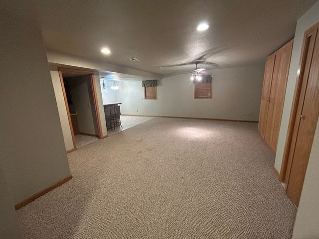 basement with light colored carpet