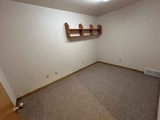 unfurnished room featuring carpet floors