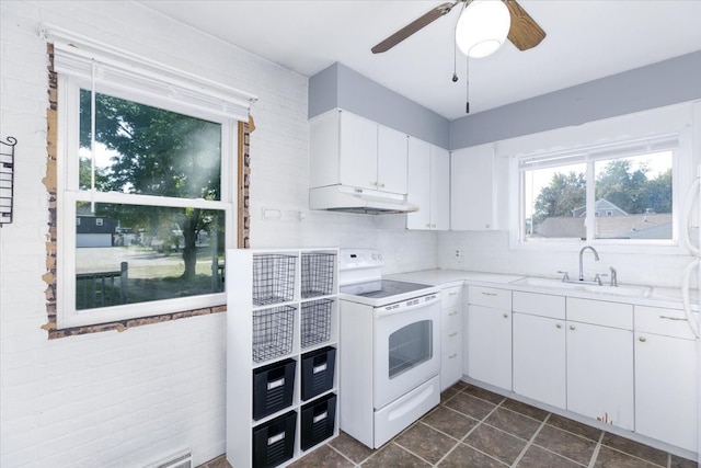 kitchen with white cabinetry, electric stove, tasteful backsplash, ceiling fan, and sink