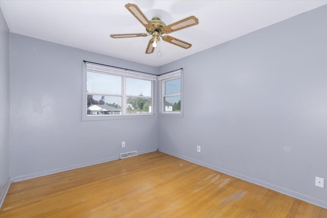 unfurnished room with ceiling fan and light hardwood / wood-style floors