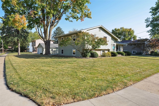 view of front of house featuring a front yard and a garage