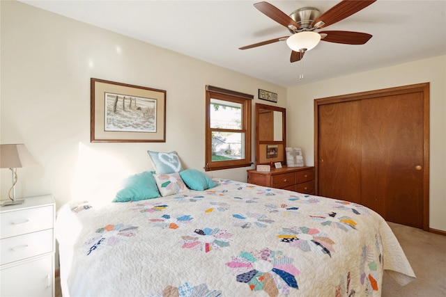 bedroom featuring ceiling fan, carpet floors, and a closet