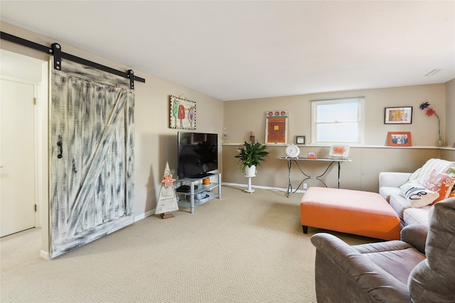 living room with carpet floors and a barn door