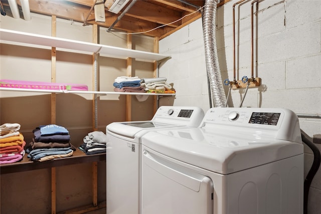 clothes washing area featuring washing machine and clothes dryer