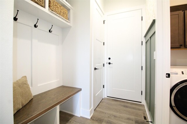 mudroom with washer / dryer and light hardwood / wood-style floors