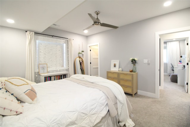 bedroom featuring ceiling fan and light colored carpet