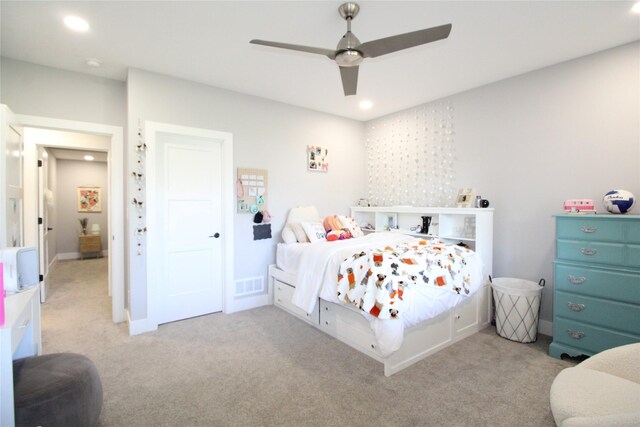 bedroom with light carpet and ceiling fan