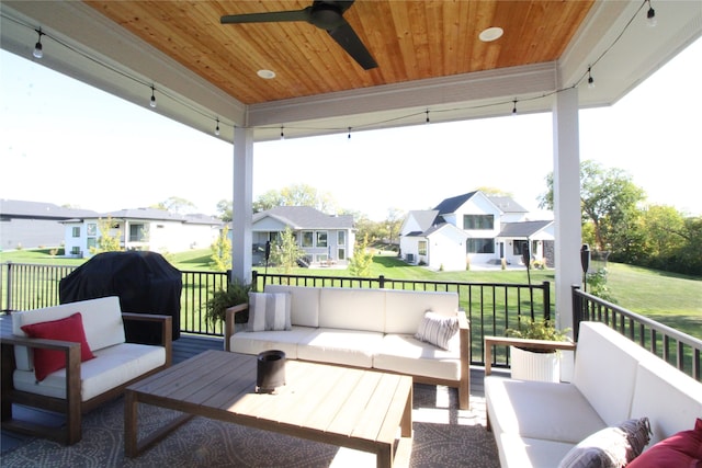 view of patio with area for grilling, outdoor lounge area, and ceiling fan