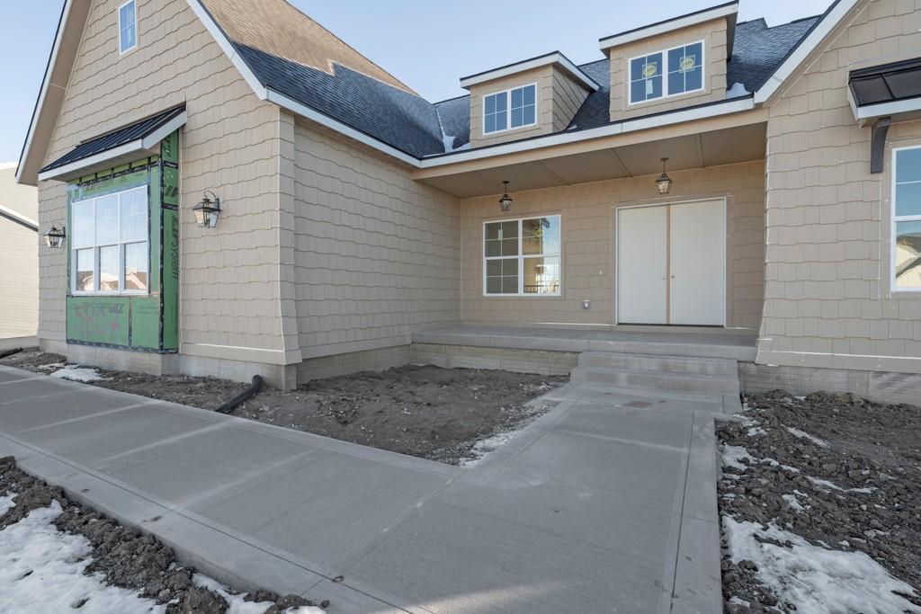 view of snow covered property entrance