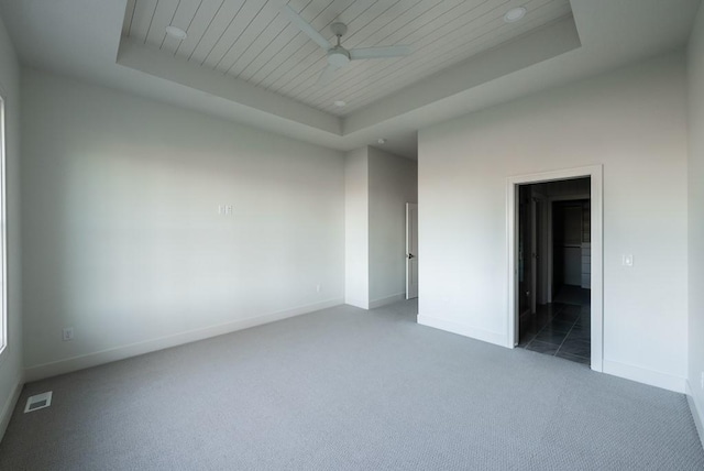 5807 NE Sherman Ct, Ankeny, IA 50021 - carpeted spare room with baseboards, visible vents, and a raised ceiling