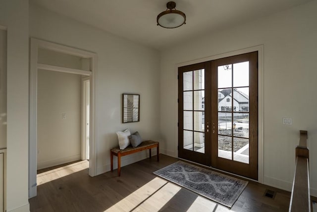 5807 NE Sherman Ct, Ankeny, IA 50021 - doorway to outside with visible vents, baseboards, wood finished floors, and french doors
