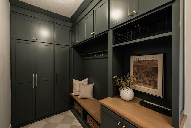 5807 NE Sherman Ct, Ankeny, IA 50021 - mudroom with light floors and a textured ceiling
