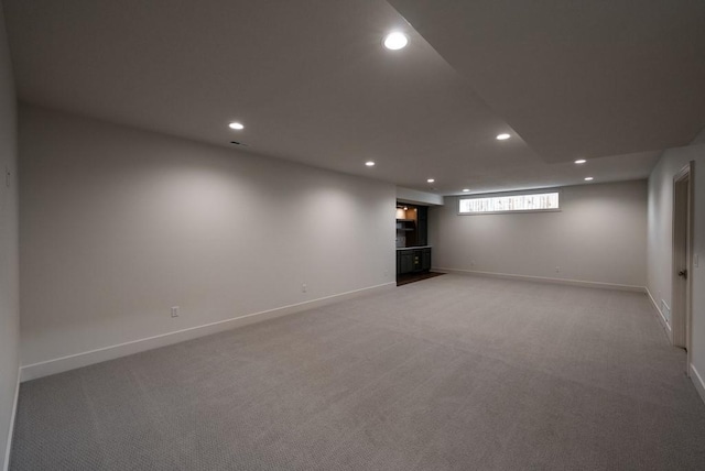 5807 NE Sherman Ct, Ankeny, IA 50021 - basement featuring baseboards, light carpet, and recessed lighting
