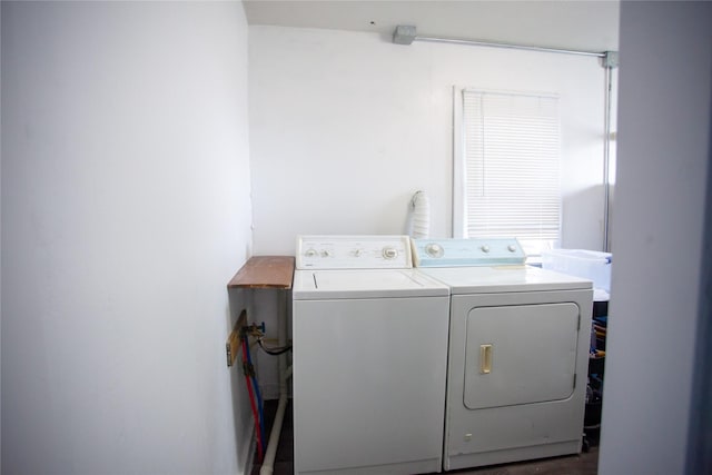 laundry room featuring washing machine and clothes dryer