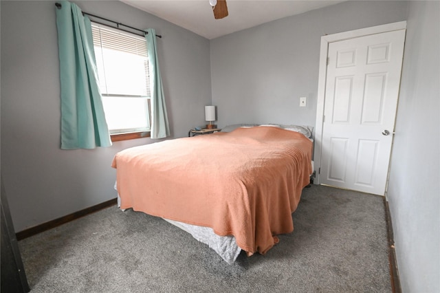 bedroom featuring ceiling fan and dark colored carpet