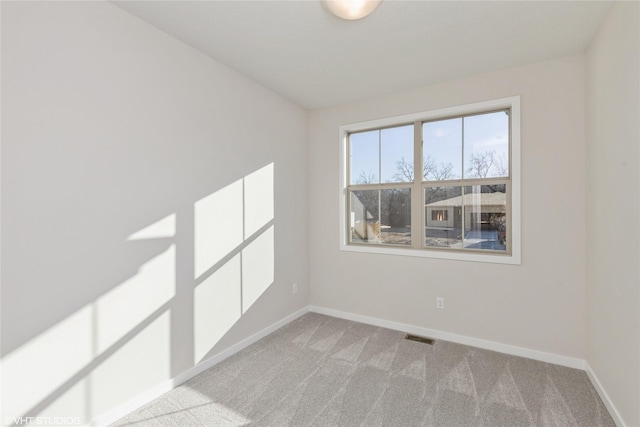 empty room featuring light carpet