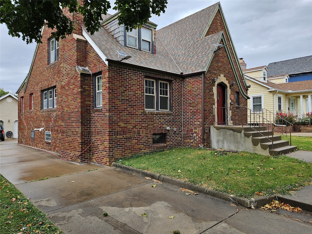 view of side of property with a yard