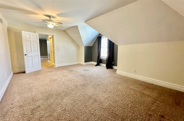 bonus room featuring lofted ceiling, ceiling fan, and light carpet