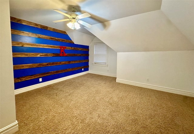 additional living space with vaulted ceiling, ceiling fan, and carpet flooring