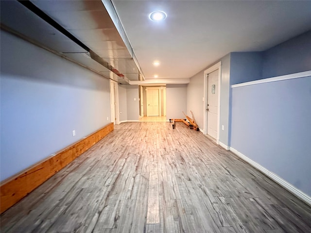 basement featuring wood-type flooring