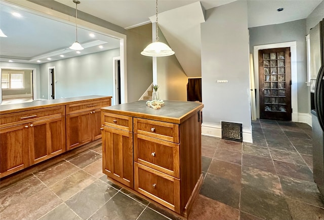 kitchen featuring hanging light fixtures and a center island