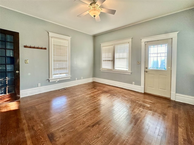 foyer entrance with ceiling fan and hardwood / wood-style flooring