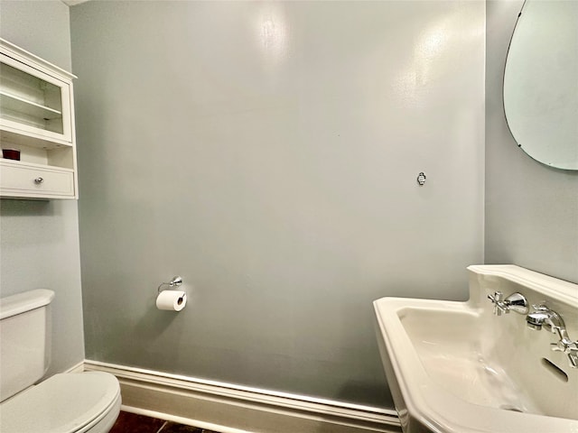 bathroom featuring sink and toilet