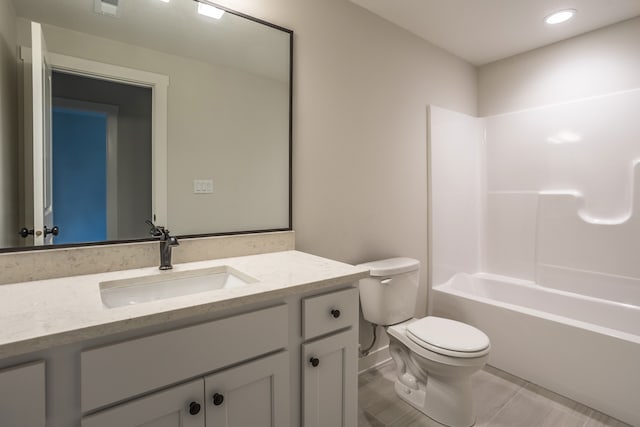 full bathroom with shower / bathtub combination, tile patterned flooring, vanity, and toilet